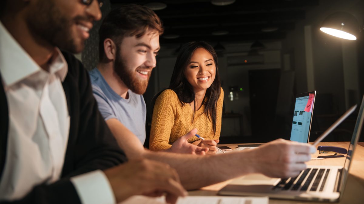 workers coding late at laptops